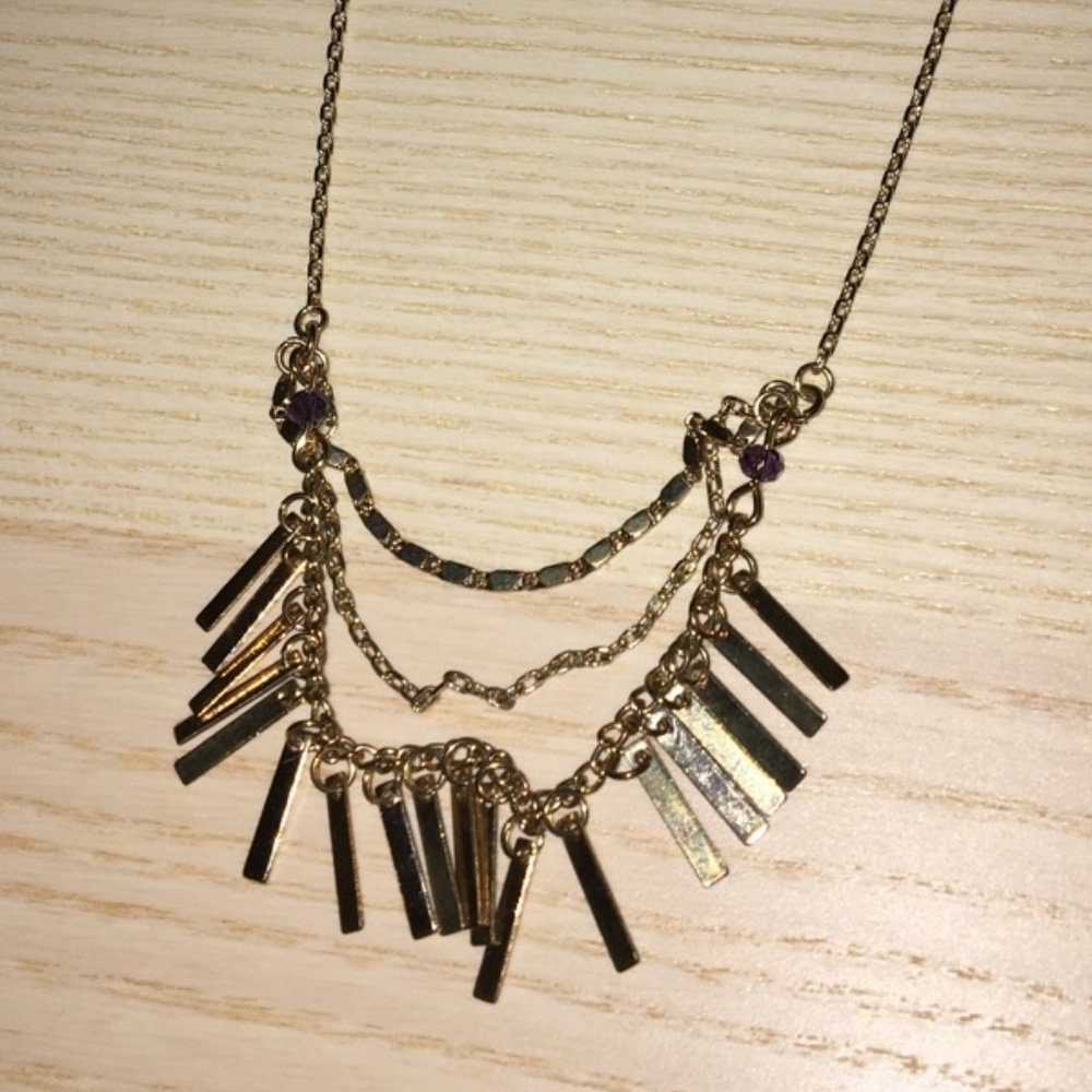 Gold necklace with bars and chains